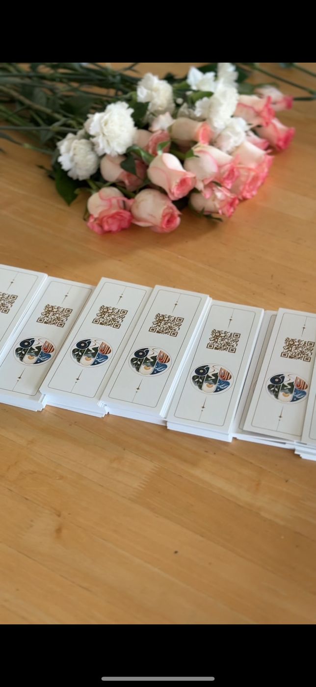 Flowers and bookmark tickets laid out on a table